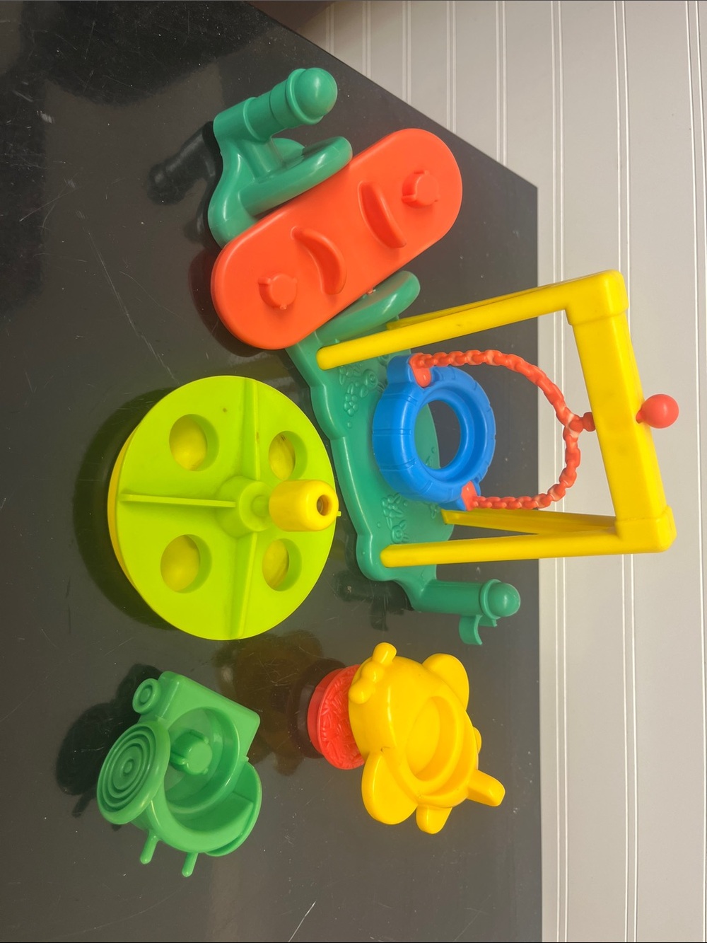 Fisher Price swing, teeter, merry go round, airplane, and wheelchair